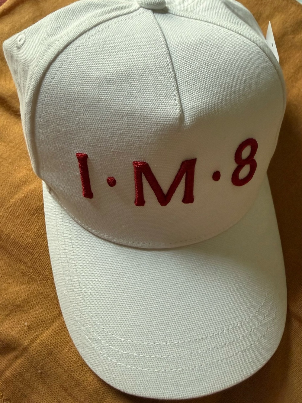 White Baseball Cap with Red "I•M•8" Interior Branding